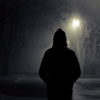 stranger walking the streets on a cold foggy night