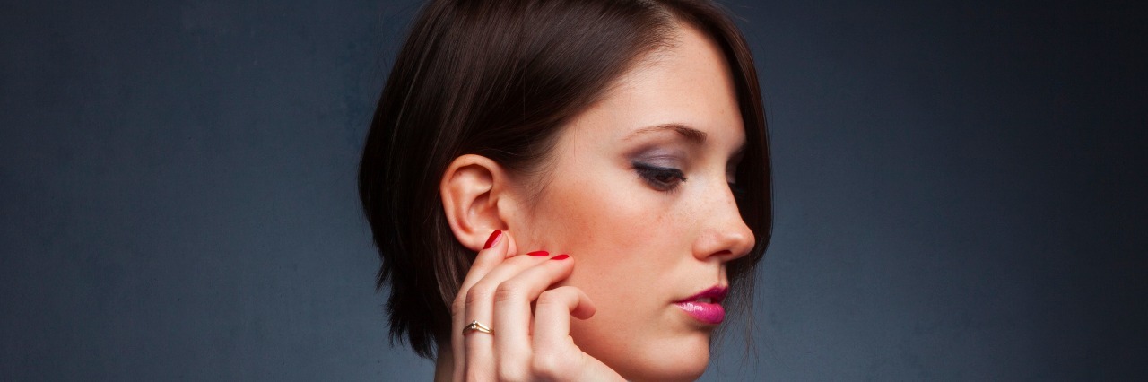 We Need More Education and Research About Misophonia Profile of woman with hand near her ear
