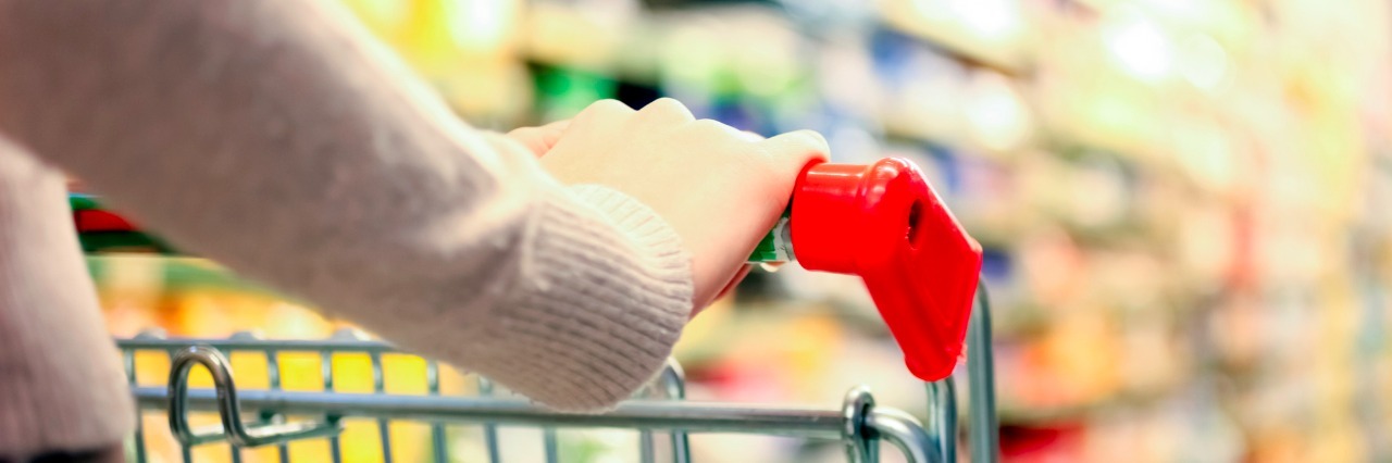 What It Feels Like to Be Mocked While Living With a Disability Woman shopping at the supermarket