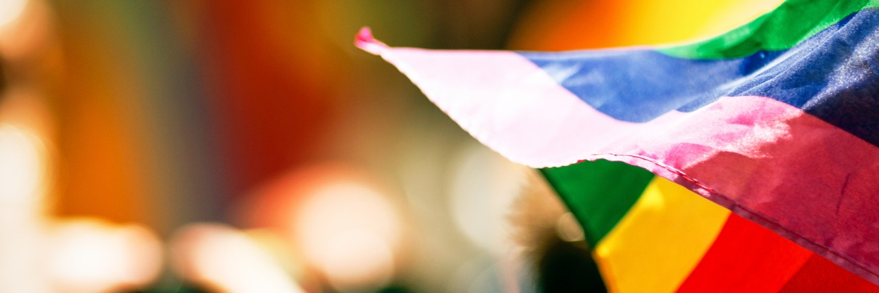 World Mental Health Day, National Coming Out Day and Invisible Disability Week Rainbow flag