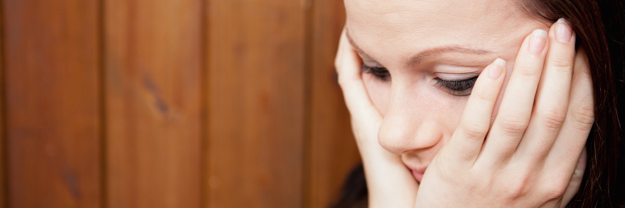 Being Unable to Trust Your Own Judgment When You're Depressed woman with her head in her hands