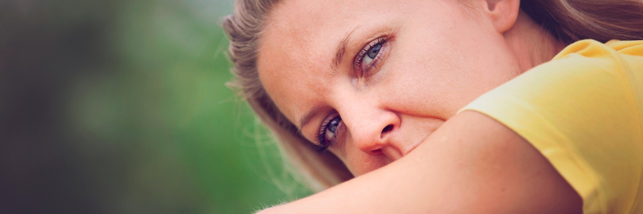 Depression: When You Want to Be Social But Aren't Always Able To woman leaned over