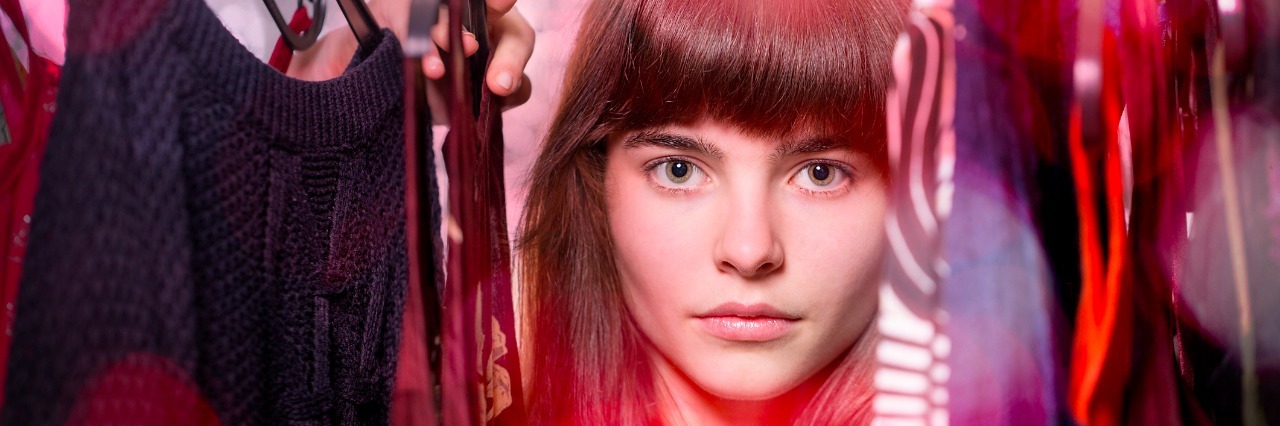 How Opening Up About OCD Helps Control Compulsions woman separating the clothes in her closet