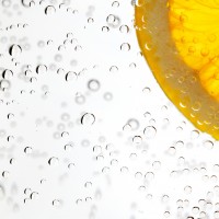 A slice of citrus lemon in a glass of water