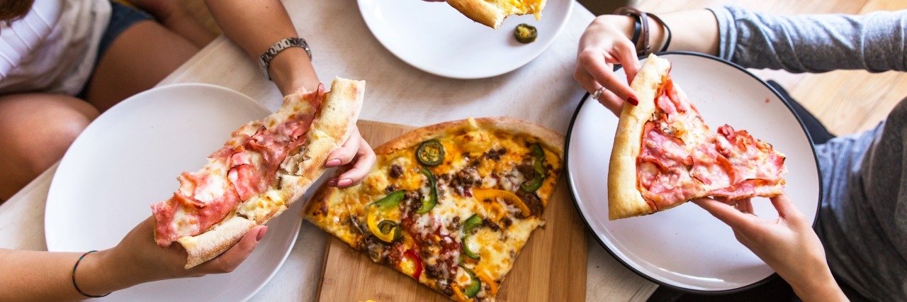 How I Manage My Eating Disorder Recovery in College group of people eating pizza