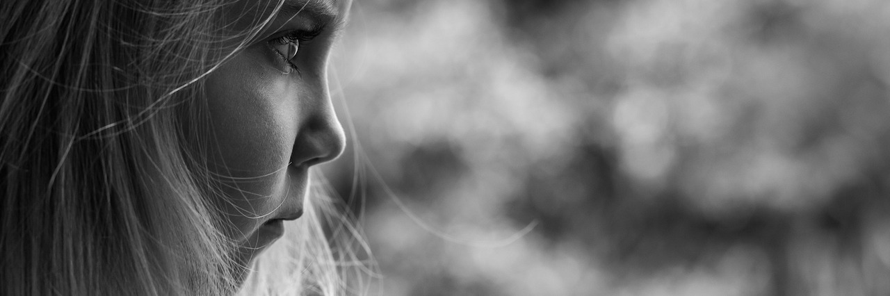 The Importance of Telling Your Story When You Have PTSD A young girl looking off