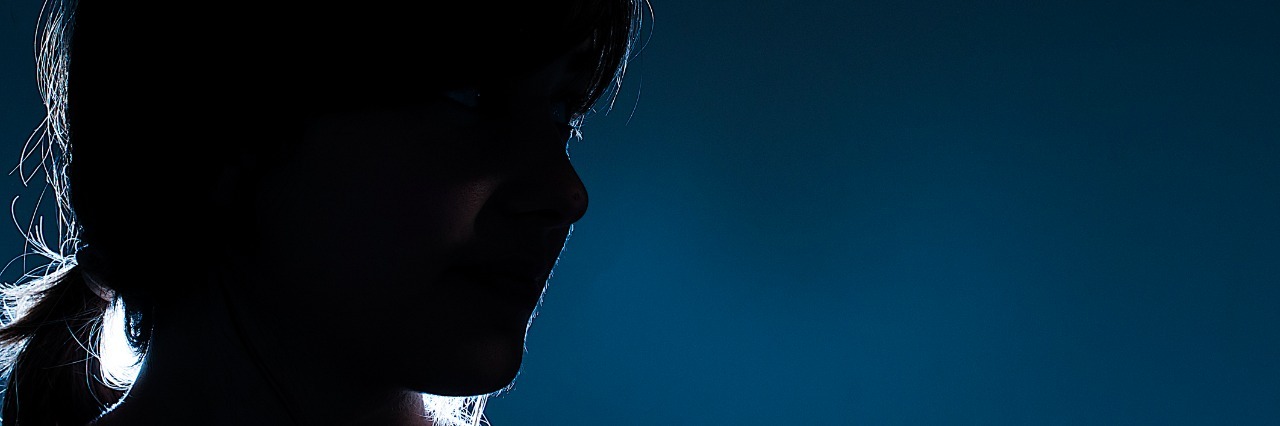 OCD Awareness Week: To the Undiagnosed silhouette of a mysterious girl on blue background