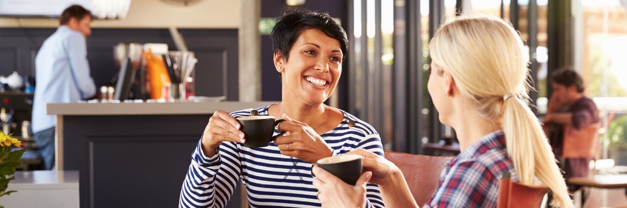 Lyme Disease: Importance of Friends Who Are Positive and Listen to You two female friends chatting and drinking coffee