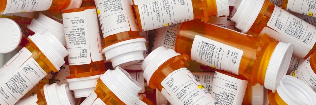 a pile of prescription medication bottles