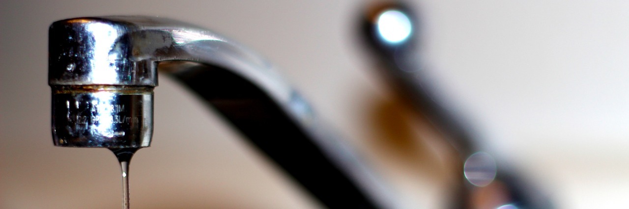 Postpartum Depression: You Can't 'Shut Off' Mental Illness close up of a dripping faucet