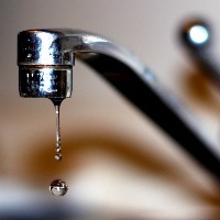 close up of a dripping faucet