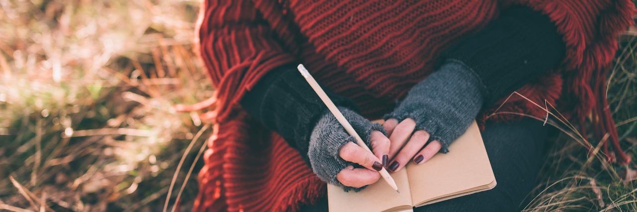 Why I Speak Openly About My Eating Disorder Recovery Woman writing in a notebook