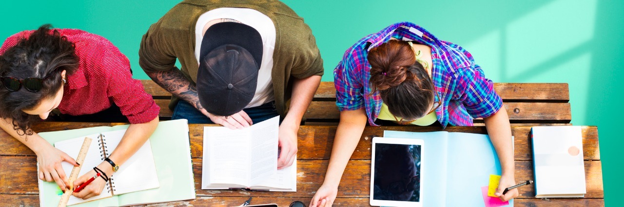 How to Respond When Someone Says 'Suicide Is Selfish' students with work out on a picnic table