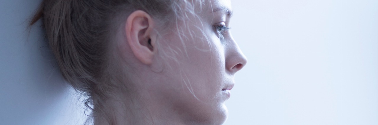 Why People Are Afraid to Recover From Depression young woman looking down