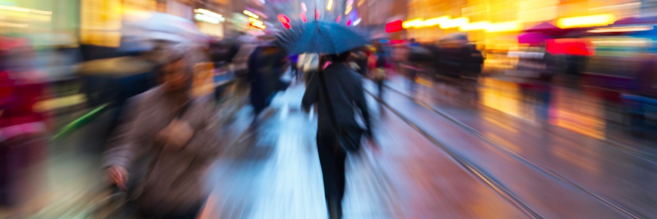 What It Feels Like to Have a Panic Attack crowded, blurry street on a rainy day