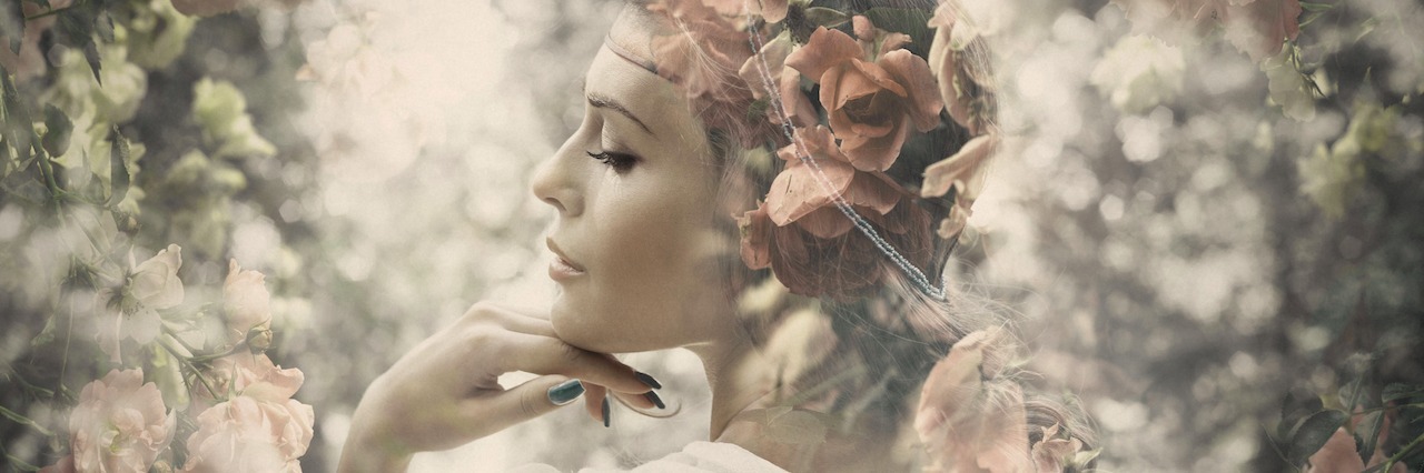 How Eating Disorder Recovery Teaches You to Treat Yourself Kindly woman surrounded by flowers