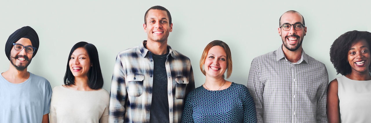 Truths About People With Mental Illnesses a group of people standing in a line against a wall