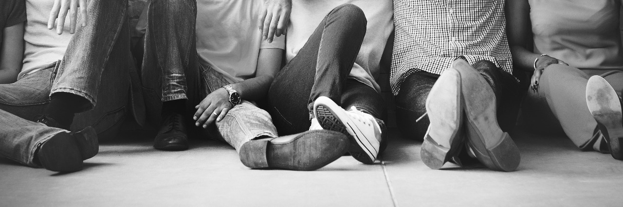 How Family, Friends and Acquaintances Can Help Someone With Depression friends sitting against a wall supporting each other