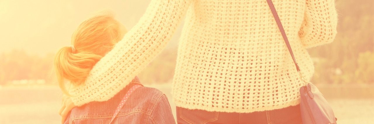 Why I'm a Better Parent While Taking Opioid Painkillers Mother and daughter enjoying the view on a lake, rear view