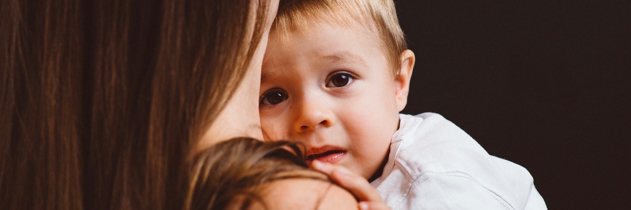 Postpartum Anxiety That Makes You Forget Your Child's Early Years a woman holding a young child
