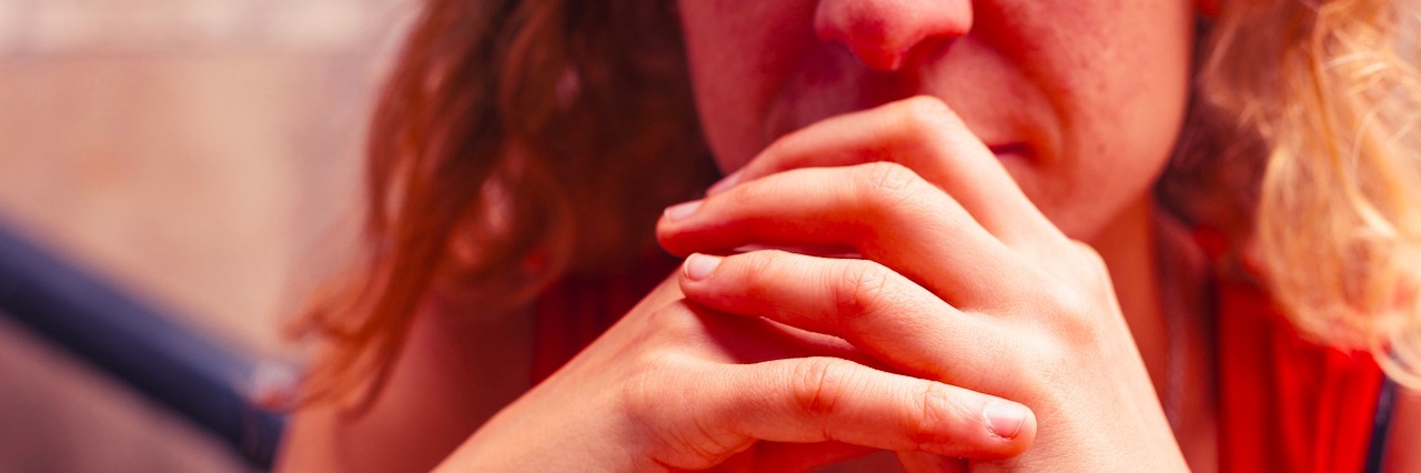 When You Hide the Anxiety You Feel as a Mother a woman with leaning on her hands