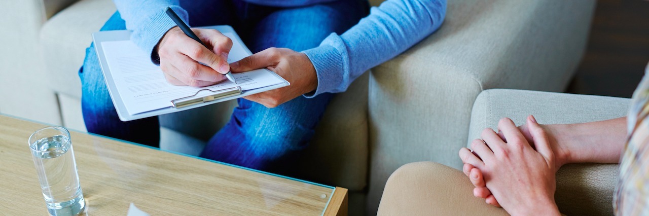 Therapist With Borderline Personality Disorder Comforts Her Patient psychologist taking notes during psychological therapy