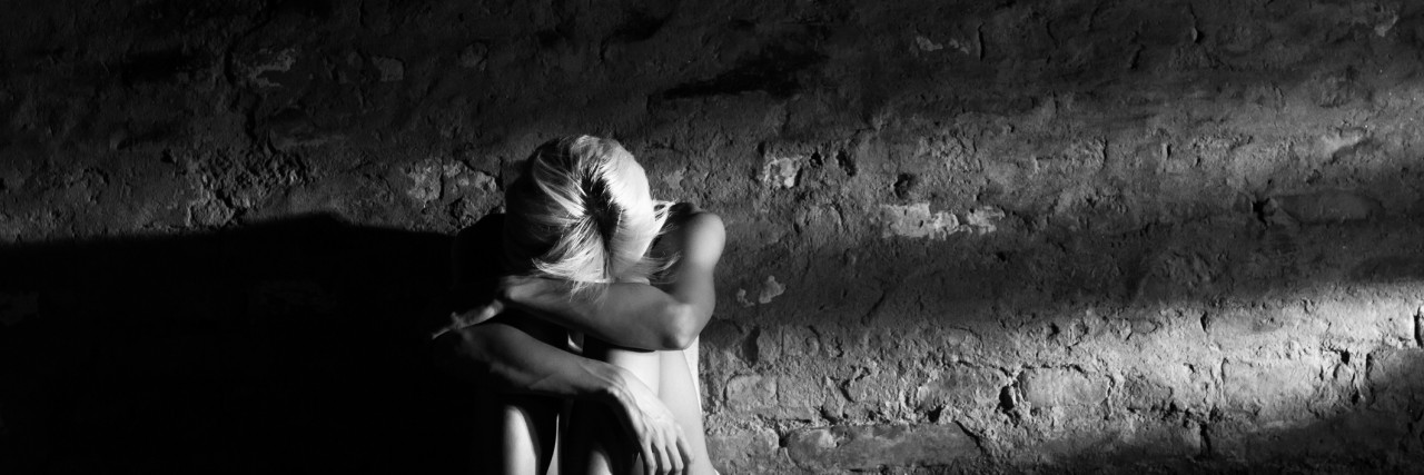 You Do Not Need to Fear Intrusive Thoughts Lonely young woman sitting on the street