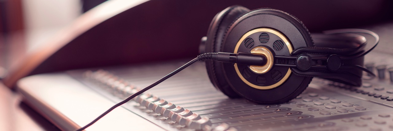 Teenager Advocates for Suicide Prevention After His Uncle's Death Headphones on the sound mixing console