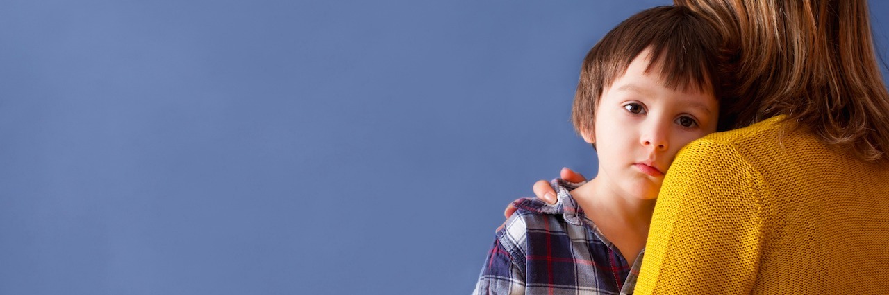 Separation Anxiety: From a Mother's Perspective mom holding a sad young boy