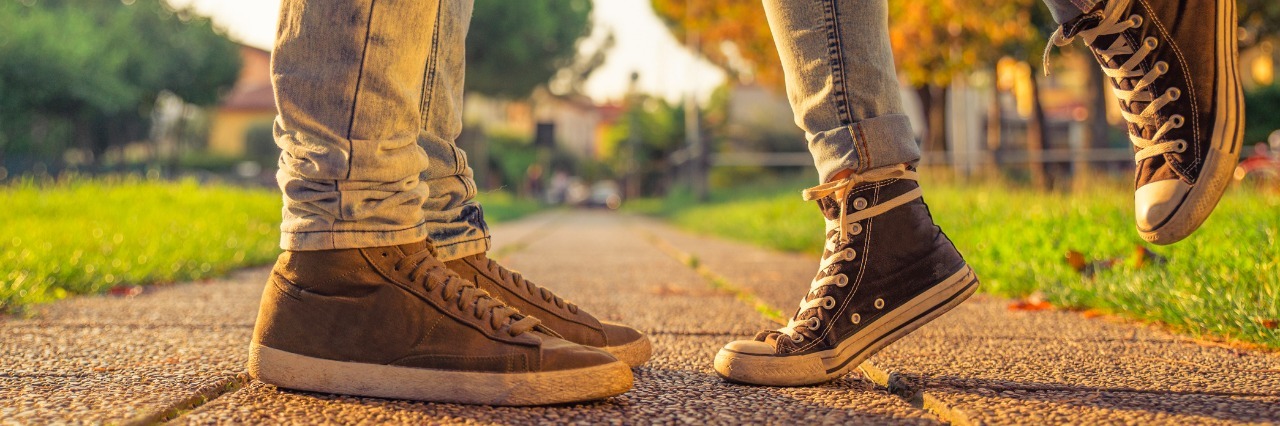 Man With Autism Responds to Bully Who Said He'd Die Alone couple kissing in a park. floor view