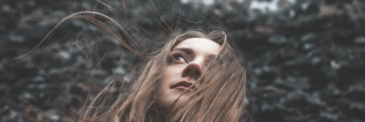 How to Help a Friend With Depression Without Saying 'I'm Sorry' young woman is looking forward