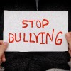 Boy holds Stop Bullying sign.