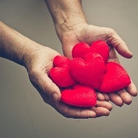 A man holding hearts
