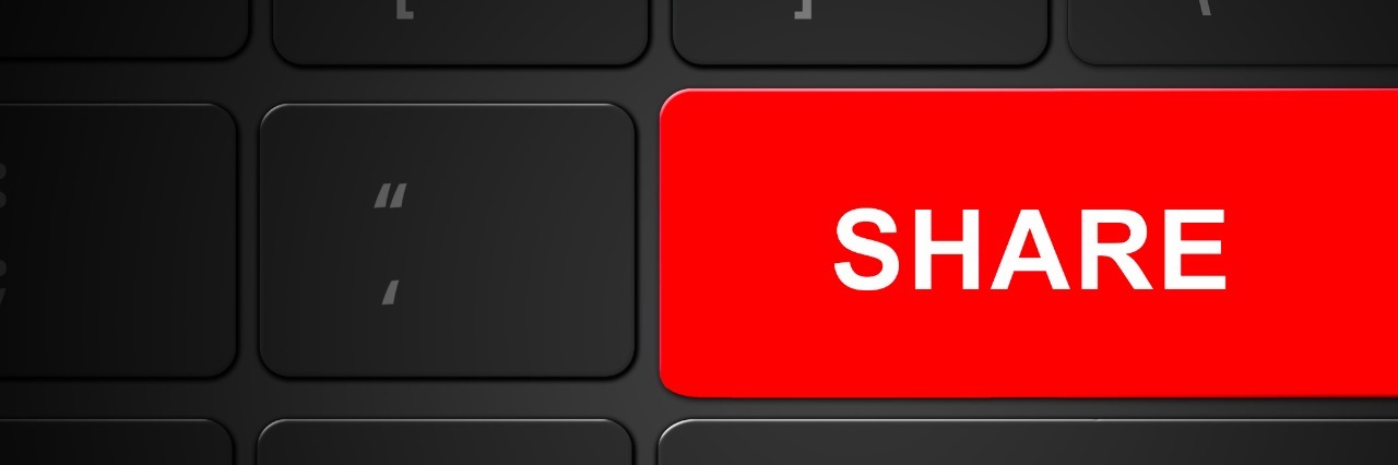 a bright red share button on a keyboard