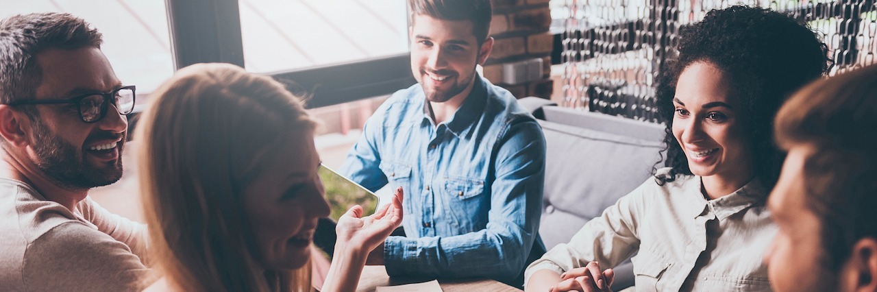 Why Every 20-Something Should See a Therapist a group of young people sitting at a table