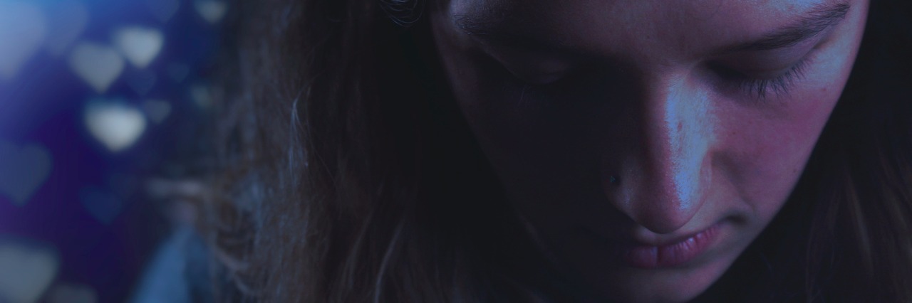 The 'Not Sick Enough' Misconception in Eating Disorders woman looking down