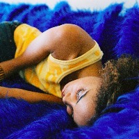 a young woman sleeping on a couch