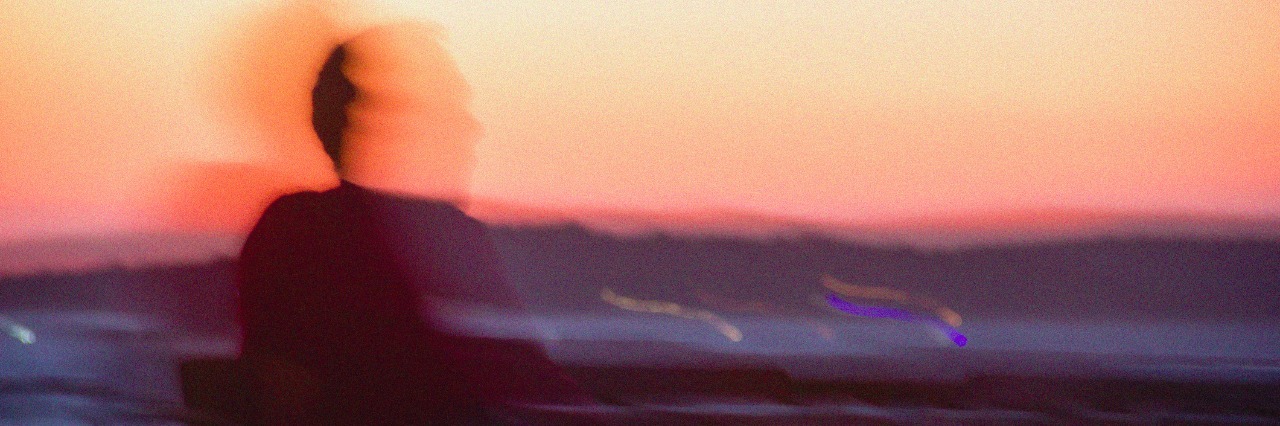 'Seeing Jerry': Supporting a Family Member With Schizophrenia Silhouette of a man sitting on a bench