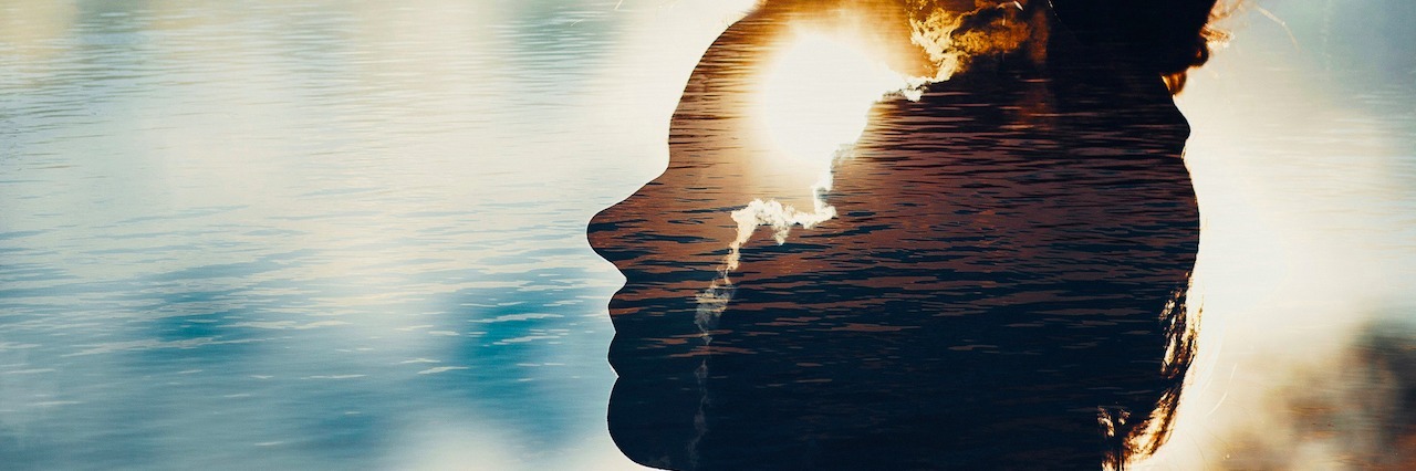 a reflection of a woman's head
