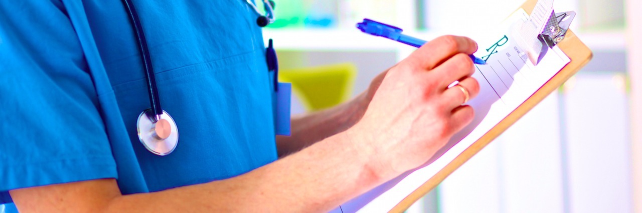 Response to a Doctor Who Dismissed a Depressed Patient's Symptoms doctor writing on a clipboard