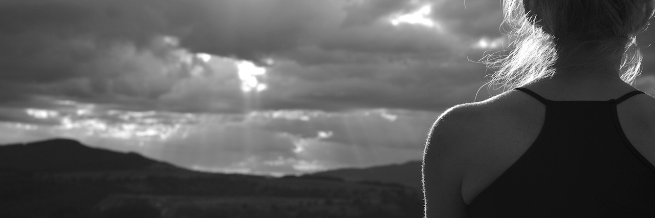 Living With Depression and Anxiety, but I Act Like 'I'm Fine' A woman who's meditating outside
