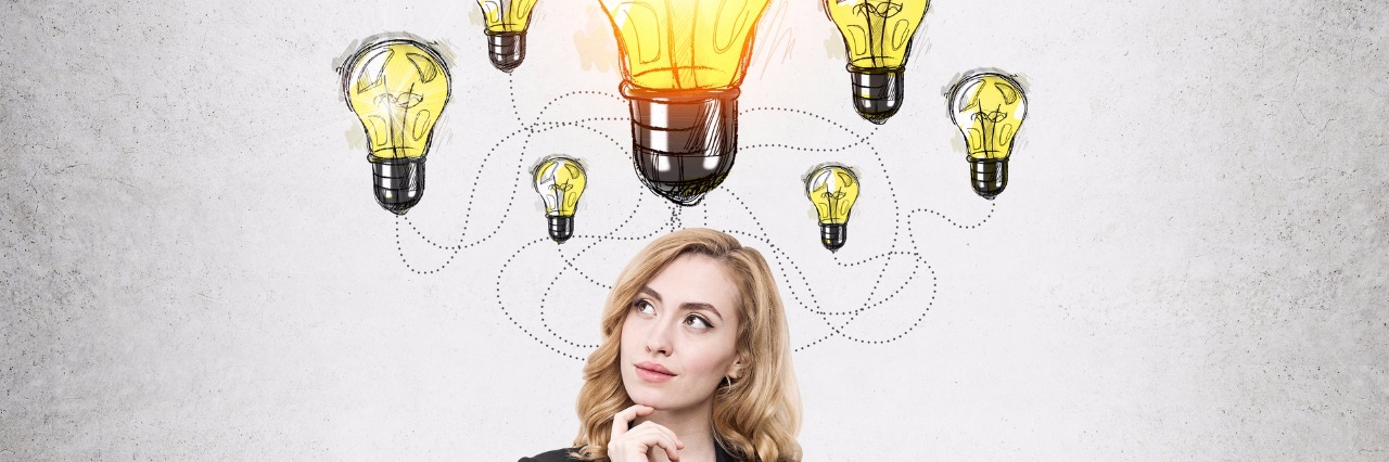 businesswoman thinking with a lightbulb over her head