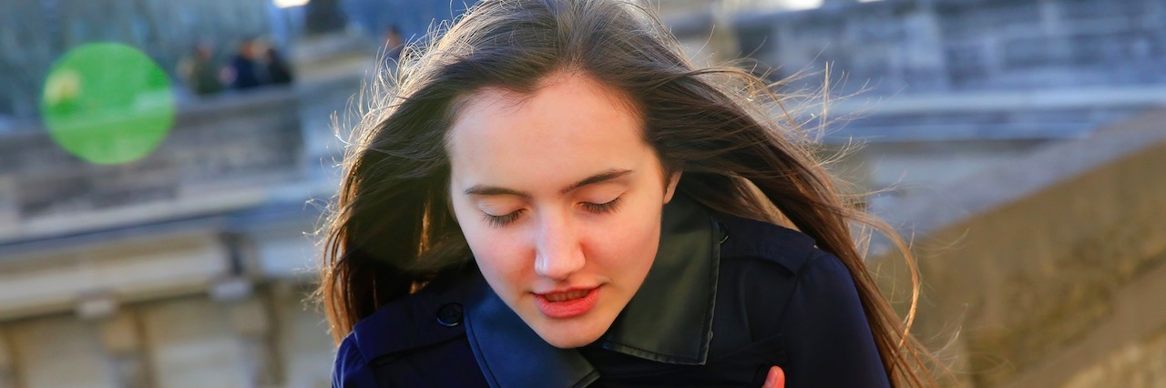 A woman walking outside in the cold