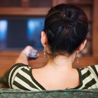 Back View of Woman Watching Television