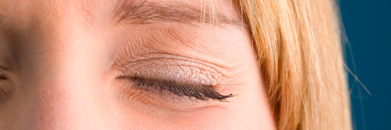 When You Can't Be Honest About Your Anxiety at Work woman closing her eyes