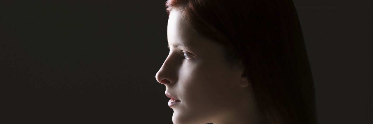 PTSD and Infant Loss: Post-Traumatic Stress Related to a Child's Death Young woman side view portrait