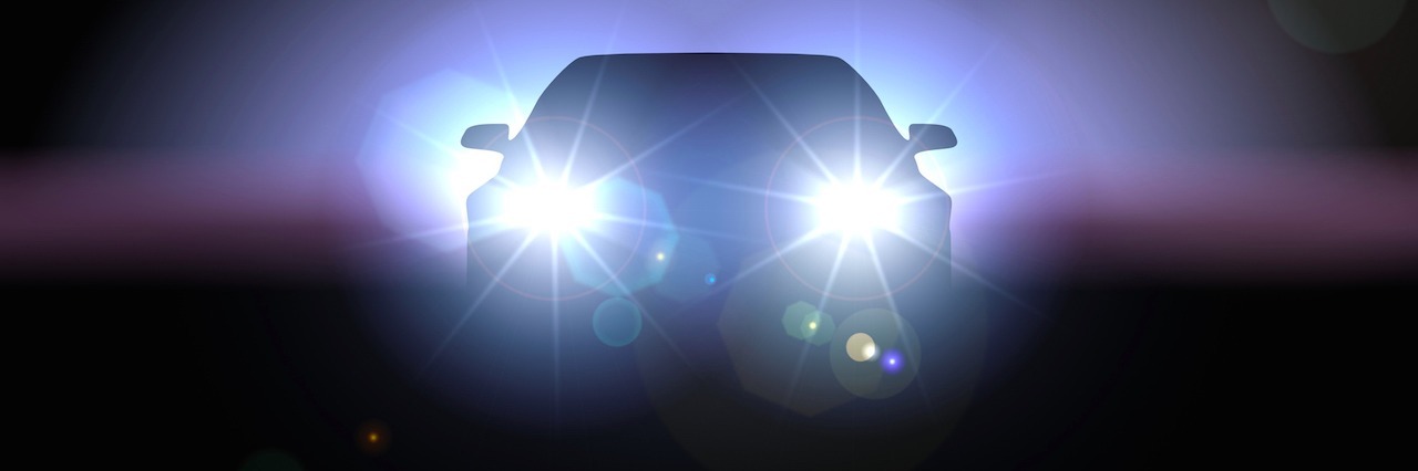 Depression: When Strangers Saw Me Cry in a Parking Garage on Halloween A car's headlights in the darkness