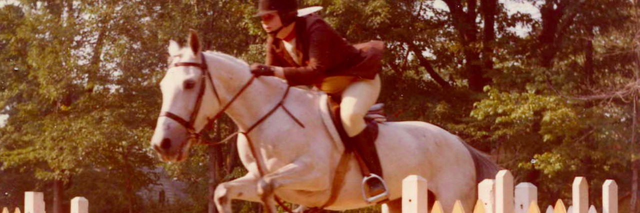 Anita age 17 on Saraha the horse jumping over fence