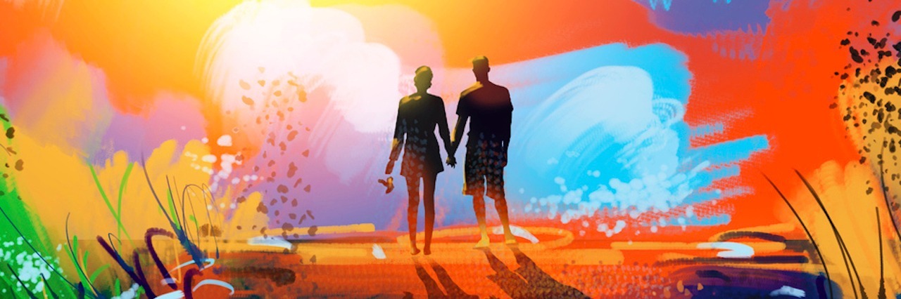 silhouette of couple holding hands and watching colorful sunset