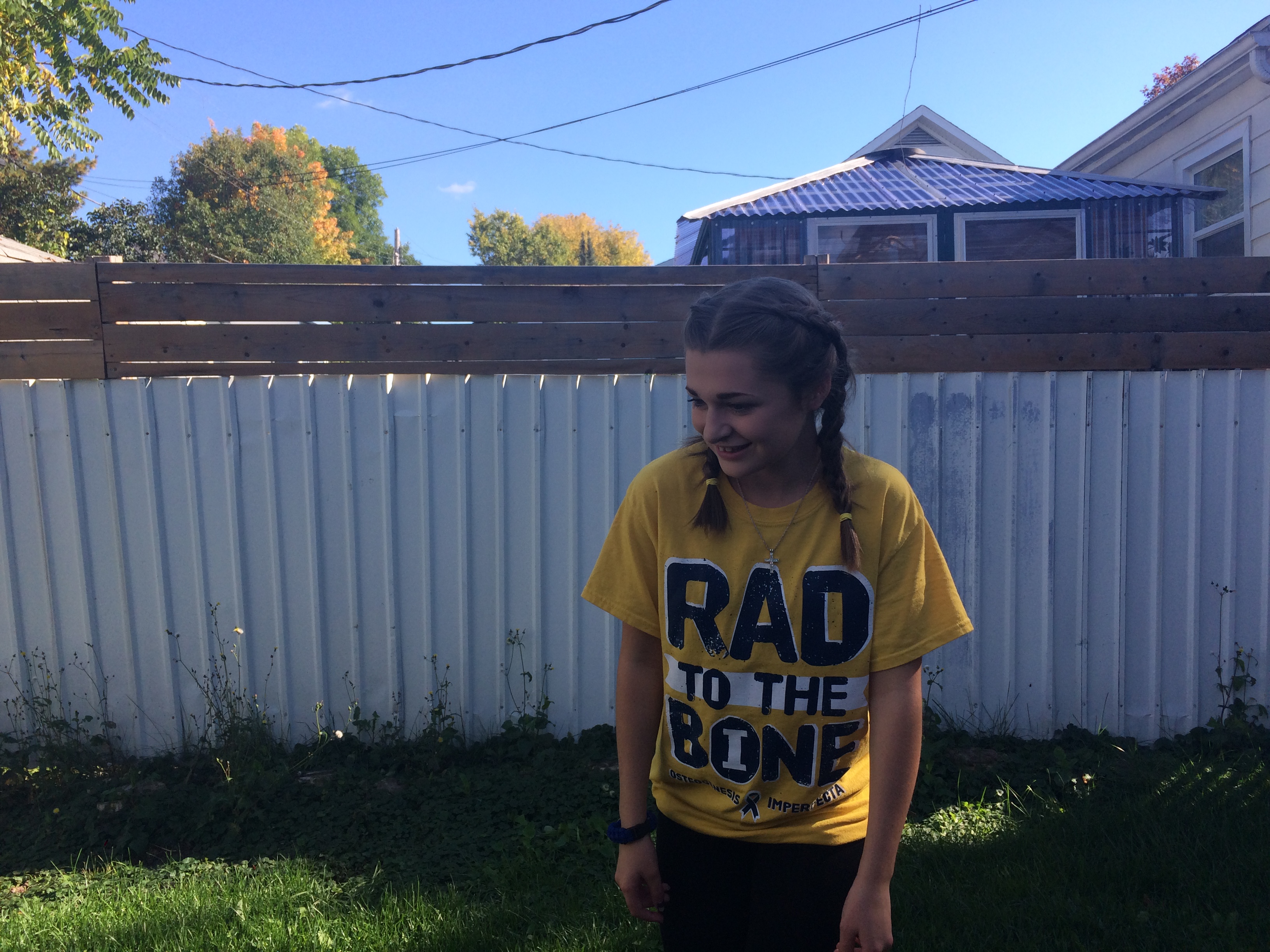 woman in 'rad to the bone' shirt